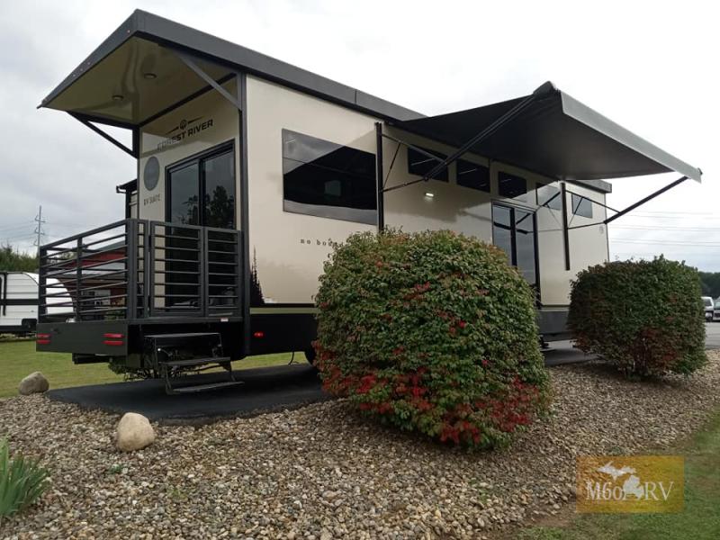 2025 Forest River RV No Boundaries RV Suite RVS3 exterior view with awnings out and back patio